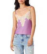 Steve Madden Miriah Top in dusty lavender satin with cream lace overlay trim, worn with distressed jeans, front view on model