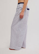Free People Cross My Heart Lounge Pant in ivory with navy pinstripes, wide-leg silhouette, elastic waistband, side view on model