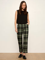 Sanctuary Quinn Bubble Shell in black, sleeveless with structured shoulders, worn by model with plaid trousers and loafers, front view