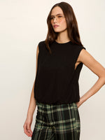 Sanctuary Quinn Bubble Shell in black, sleeveless with crew neck and gathered hem, worn by model with plaid trousers, front view