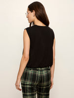 Sanctuary Quinn Bubble Shell in black, back view on model wearing plaid trousers, sleeveless with relaxed silhouette