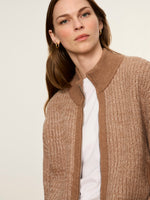Sanctuary Zip Up Sweater Jacket in Heather Cocoa worn by model, featuring textured knit, ribbed collar, and silver zipper over white tee