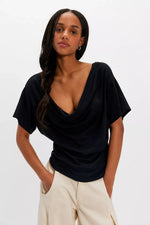 Free People Waterfall Cowl in Black — model wearing draped cowl-neck short-sleeve top with flutter sleeves, front view