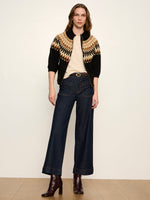 Sanctuary Poconos Fairisle Zip Up cardigan in black with tan and gold Fair Isle yoke pattern, worn by model with wide-leg jeans