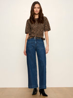 Sanctuary Perfect Sweater Tee in Le Cat leopard print, short puff sleeves, crew neck, worn by model with wide-leg jeans, front view