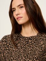 Sanctuary Perfect Sweater Tee in Le Cat leopard print, close-up detail shot on model showing tan and black animal print fabric