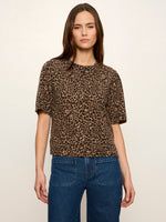 Sanctuary Perfect Sweater Tee in Le Cat leopard print, cropped boxy fit with short sleeves, worn by model with blue jeans, front view.