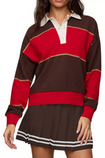 Z SUPPLY Study Break Polo Sweatshirt in Game Day Red, brown and red colorblock stripes with white collar, worn by model with matching pleated skirt