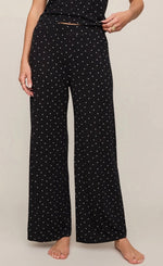 Z Supply Luxe Dot Pant in black with white polka dots, wide-leg silhouette, fold-over waistband, model front view