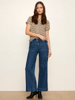Sanctuary The Perfect Tee in Inkblot — beige short-sleeve tee with black abstract brushstroke print, worn by model with wide-leg jeans, front view.