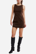 Free People Atlas Suede Mini dress in chocolate brown, sleeveless A-line silhouette, worn by model with black knee-high boots, front view