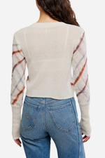 Free People Highland Mist Cardi in Sugar Mist Combo, back view on model, cream knit body with plaid patterned sleeves and ribbed cuffs