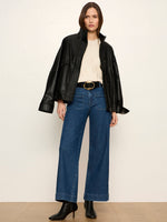 Sanctuary Alana Jacket in black faux leather, oversized fit with chest pockets, worn by model with wide-leg jeans, front view