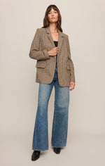 Z SUPPLY Evan Check Blazer in dark chocolate houndstooth, worn by model with wide-leg jeans, front view showing notched lapel and flap pockets