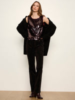 Sanctuary The Desired Pailette Shell in Bordeaux, a sleeveless sequin top worn by a model with black velvet trousers and oversized cardigan