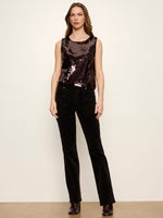 Sanctuary Desired Pailette Shell in bordeaux — sleeveless sequin tank top with round neck, worn by model with black velvet pants, front view