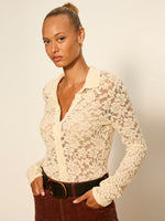 Sanctuary Dreamer Lace Shirt in bone, floral lace collared bodysuit with long sleeves, worn by model with brown corduroy pants