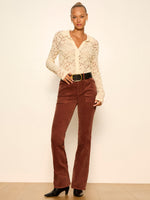 Sanctuary Play Date Corduroy Bootcut pants in Burnt Cocoa, front view on model styled with cream lace top and black belt