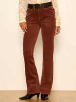 Sanctuary Play Date Corduroy Bootcut pants in Burnt Cocoa, front view on model with black belt and lace top