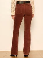 Sanctuary Play Date Corduroy Bootcut pants in Burnt Cocoa, back view on model with black belt and lace top