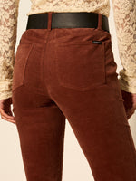 Sanctuary Play Date Corduroy Bootcut pants in Burnt Cocoa, back view on model with black leather belt and lace top