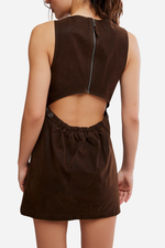 Free People Atlas Suede Mini dress in chocolate brown, back view on model showing open-back cutout design with zipper and snap closures