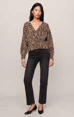 Z SUPPLY All The Wild Cardigan in dark chocolate zebra print, front view on model styled with black straight-leg jeans