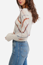 Free People Highland Mist Cardi in Sugar Mist Combo, cream plaid knit sweater with rust and blue stripes, side view on model with jeans.