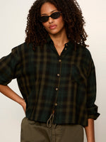 Sanctuary Autumn Edit Flannel in Forest Plaid — cropped dark green tartan button-up shirt worn by model with sunglasses, front view