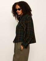 Sanctuary Autumn Edit Flannel in Forest Plaid — cropped dark green plaid shirt on model, side view, paired with olive cargo pants