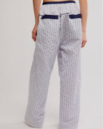 Free People Cross My Heart Lounge Pant in Ivory Combo, back view on model, white seersucker stripe with navy elastic waistband and back pockets