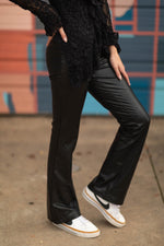 RD Style Fabiana Stretch Faux Leather Pull On flare pants in black, worn by model with black lace top and white Nike sneakers