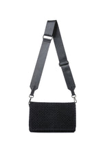 Haute Shore Lexi Woven Crossbody in Jet Black, front view with adjustable gray nylon strap on white background
