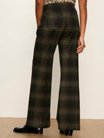 Sanctuary Relay Pull On Pant in Kalamata Plaid, back view on model showing wide-leg silhouette and dark green tartan pattern