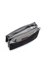 Haute Shore Lexi Woven Crossbody in Jet Black, open interior view showing gray fabric lining, zip pocket, and pink brand label