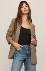 Z SUPPLY Evan Check Blazer in dark chocolate houndstooth worn open over black cami with blue jeans, front view on model