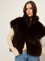 Sanctuary Silky Fur Vest in Espresso Martini dark brown worn over cream lace top with jeans, front zip closure, model view