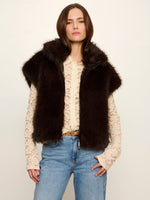 Sanctuary Silky Fur Vest in Espresso Martini dark brown, worn open over lace blouse and jeans, front view on model