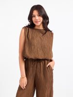 Sadie and Sage Sepia Sky Bubble Top in Bronze Olive, sleeveless crinkle-texture top with boat neckline, worn with matching wide-leg pants, front view on model