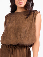 Sadie and Sage Sepia Sky Bubble Top in Bronze Olive — sleeveless crinkle-textured top with bateau neckline and elasticized waist on model