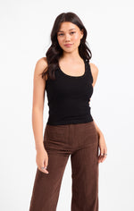 Sadie Ruby Studded Knit Tank in black, front view on model, featuring scoop neck with stud trim and ribbed fabric