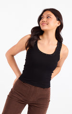 Sadie Ruby Studded Knit Tank in black, front view on model, featuring scoop neck with stud embellishments and ribbed fabric