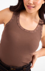 Sadie Ruby Studded Knit Tank in brown ribbed fabric with metal stud trim along neckline and straps, worn by a model
