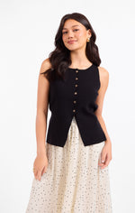 Sadie Margaux Sweater Waistcoat in black, front view on model, featuring button-front detail and structured knit fabric