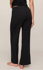 Z Supply Luxe Dot Pant in black with white polka dots, back view on model, wide-leg silhouette, elastic waistband