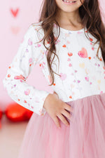 Mila Better Together L/S Tutu Dress close-up on girl, white long-sleeve top with watercolor heart print and pink tulle skirt