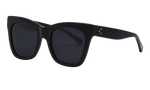 I SEA Billie sunglasses in matte black with dark smoke polarized lenses, oversized square cat-eye frame, angled side view