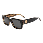 I SEA Cole Houshmand sunglasses in black leopard with smoke polarized lenses, rectangular frame, gold medallion detail, three-quarter view