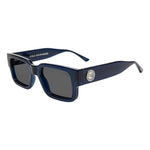 I SEA Cole Houshmand sunglasses in dark navy blue acetate frames with smoke polarized lenses and silver medallion logo, angled view