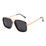 I-SEA Cruz sunglasses in tortoise and gold with dark smoke polarized lenses, square aviator style, angled side view